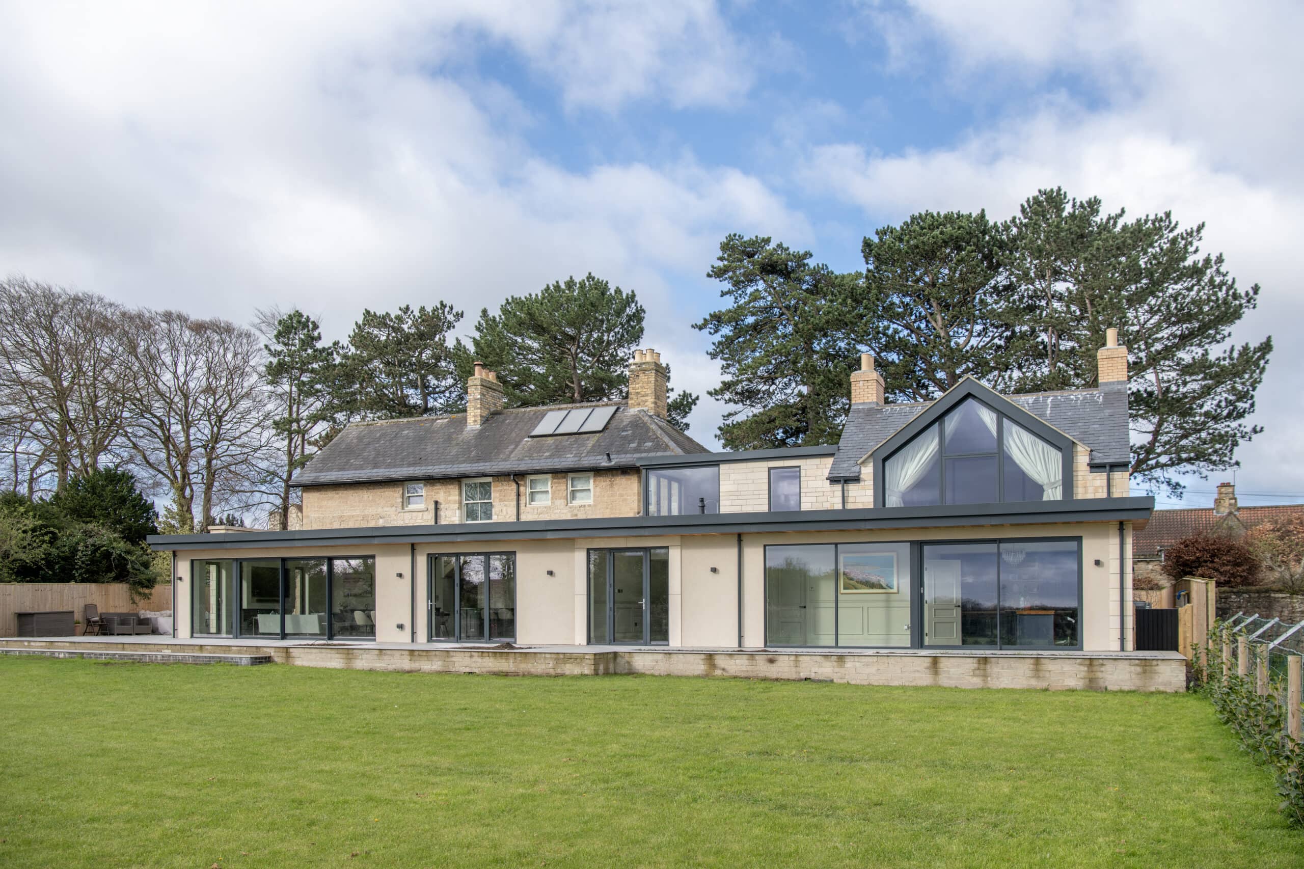 Modern flat roof extension with glass doors