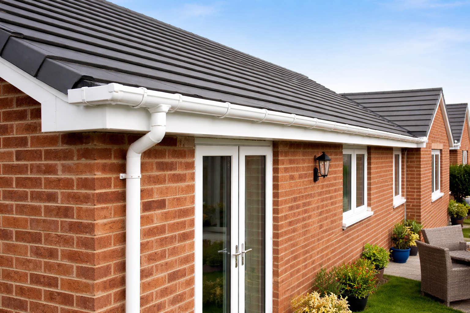 Newly installed guttering on modern bungalow